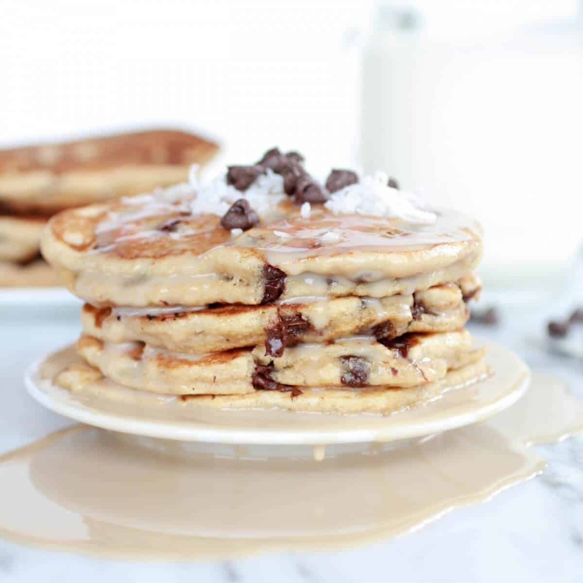 Whole Wheat Chocolate Chip Banana Bread Pancakes with a Vanilla Coconut Glaze