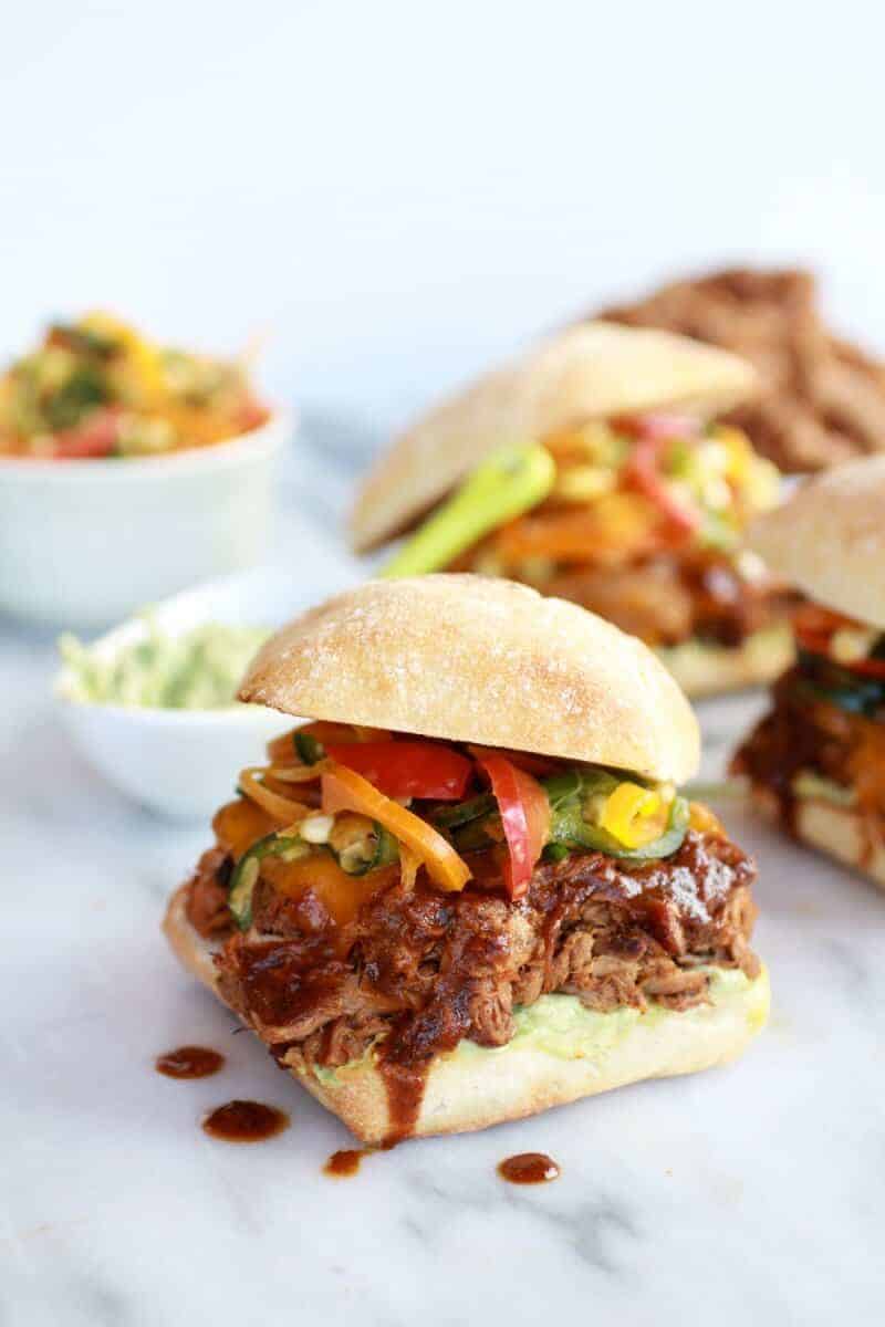 Cheesy Crockpot Cajun Pulled Pork with Southwest Pepper-Corn Slaw | halfbakedharvest.com