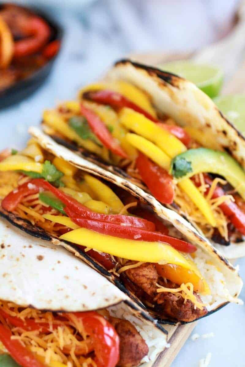 Easy Chicken Fajitas with Thai Mango Slaw and Coconut Rice | halfbakedharvest.com/