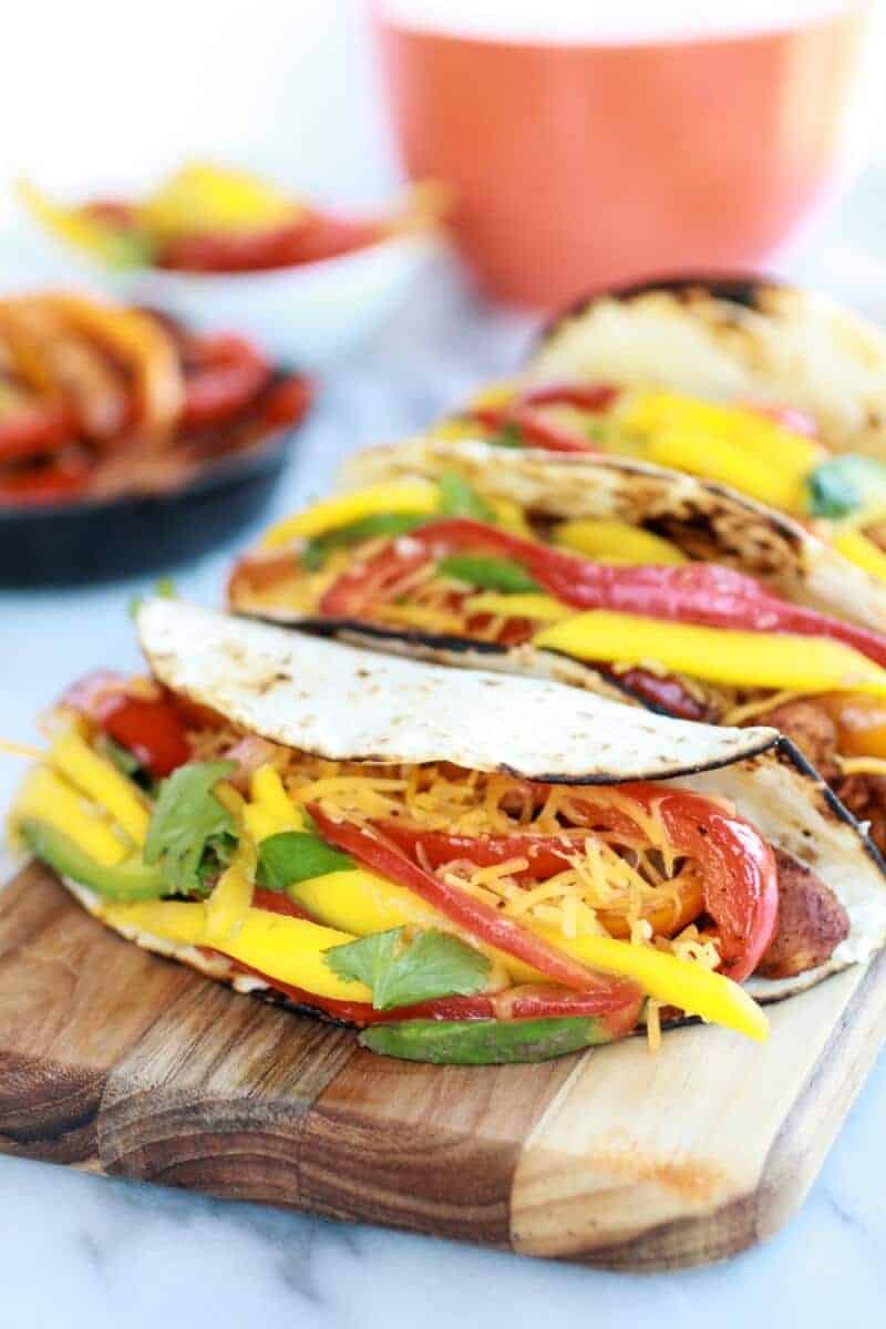 Easy Chicken Fajitas with Thai Mango Slaw and Coconut Rice | halfbakedharvest.com/
