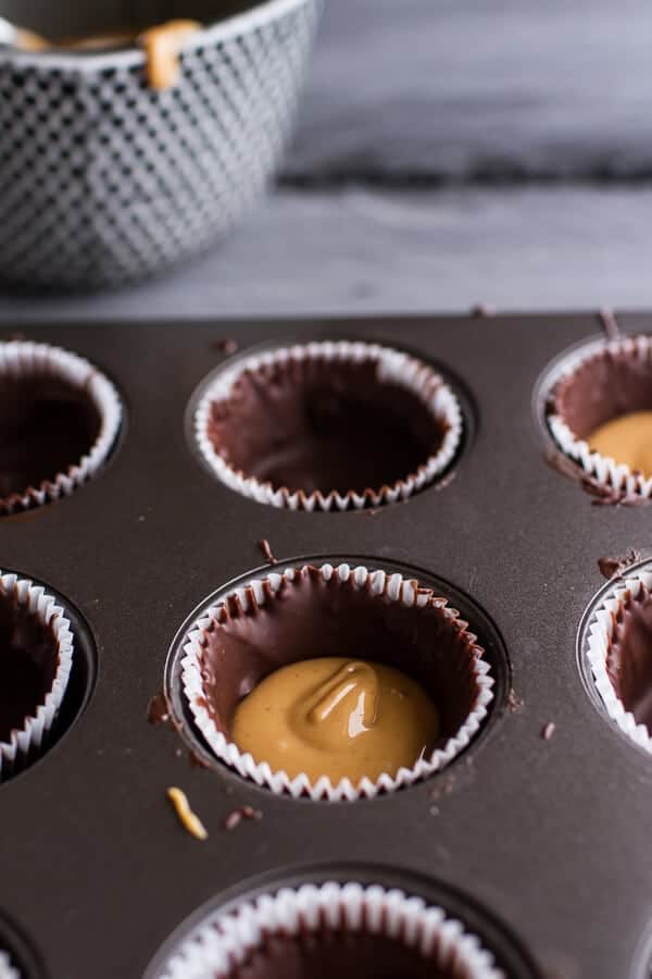 Mini Chocolate Pumpkin Seed Candy Peanut Butter Cups | halfbakedharvest.com @hbharvest