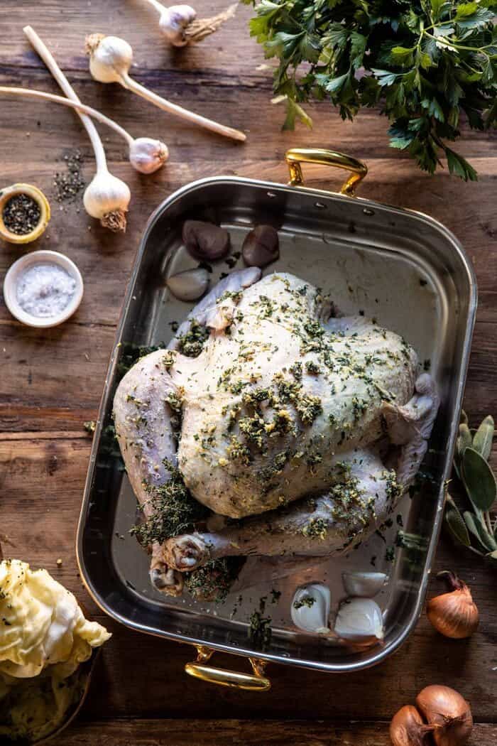 overhead photo of Herb and Butter Roasted Turkey before adding cheesecloth and before roasting 