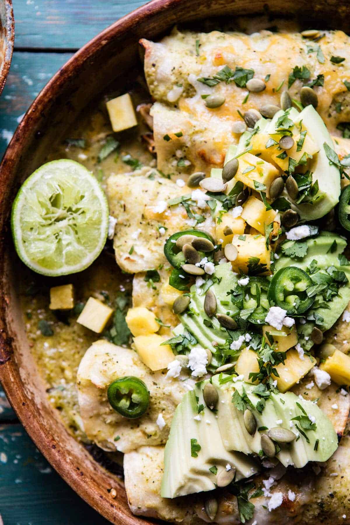 Lightened Up Salsa Verde Chicken Enchiladas with Pineapple Avocado Salsa | halfbakedharvest.com @hbharvest