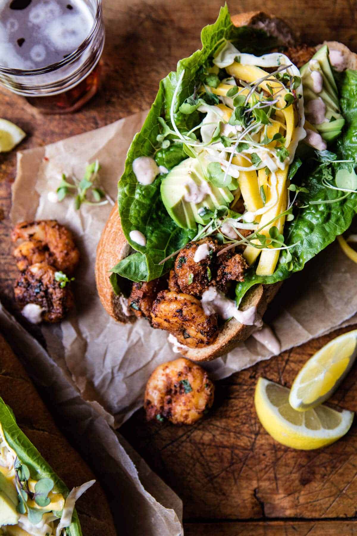 Lighter Shrimp Po Boys with Avocado Mango Slaw | halfbakedharvest.com @hbharvest