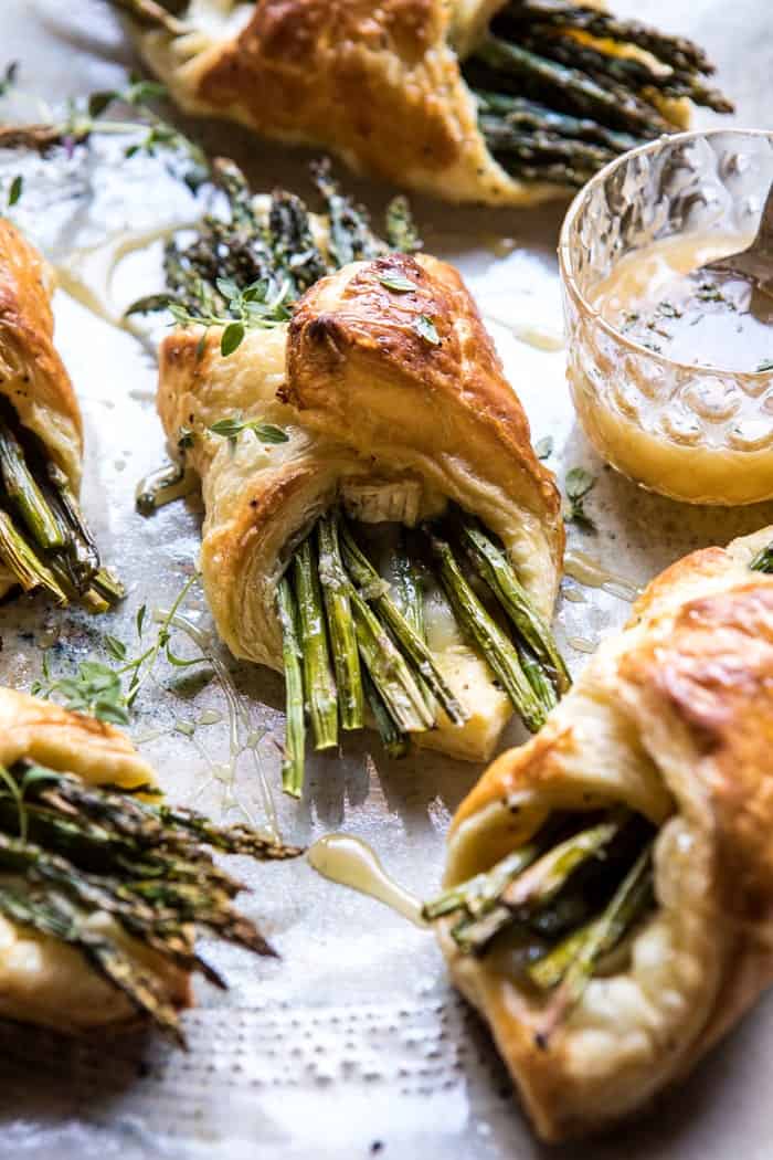 Asparagus and Brie Puff Pastry with Thyme Honey | halfbakedharvest.com #brunch #spring #recipe side photo of Asparagus and Brie Puff Pastry with Thyme Honey
