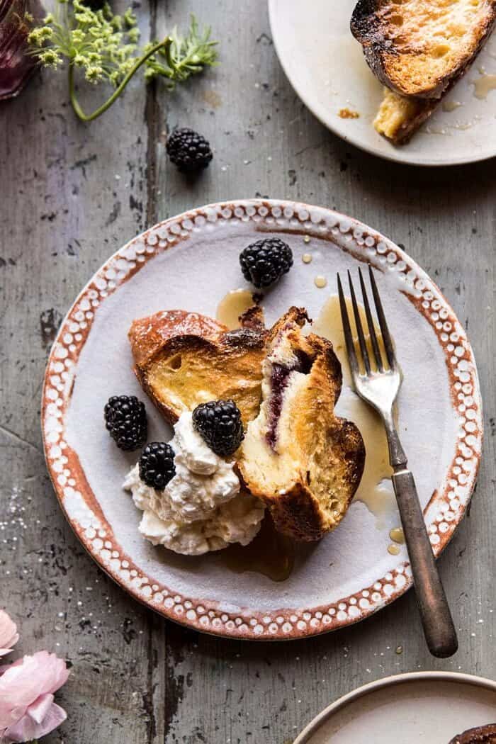 Baked Blackberry Ricotta French Toast | halfbakedharvest.com #breakfast #brunch #easy #recipes cut into photo of Baked Blackberry Ricotta French Toast