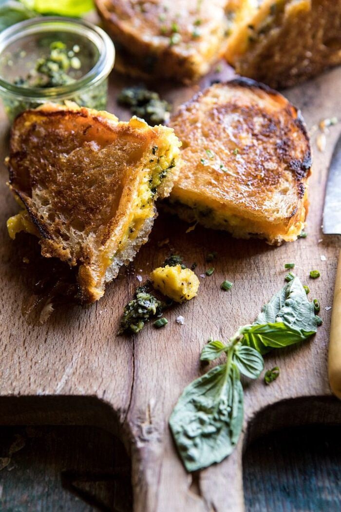 Breakfast Grilled Cheese with Soft Scrambled Eggs and Pesto | halfbakedharvest.com #breakfast #brunch #grilledcheese front on photo of Breakfast Grilled Cheese with Soft Scrambled Eggs and Pesto