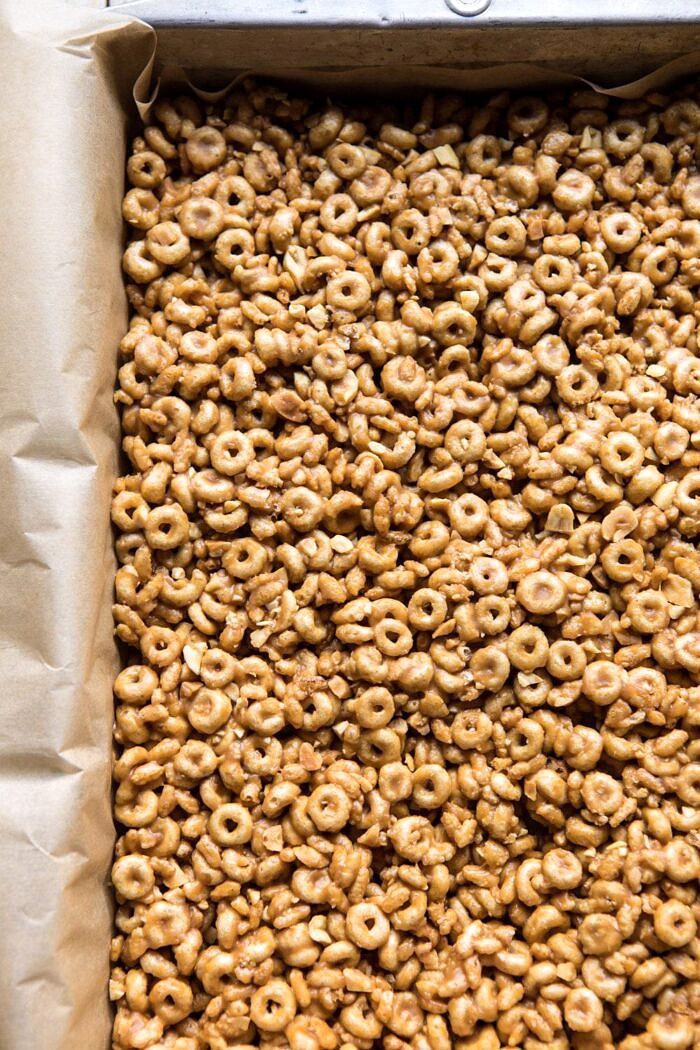 Chocolate Dipped Peanut Butter and Honey Cheerio Bars | halfbakedharvest.com #chocolate #dessert #easyrecipe raw prep photo of Peanut Butter and Honey Cheerio Bars