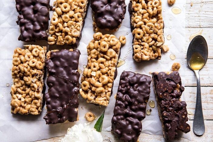 Chocolate Dipped Peanut Butter and Honey Cheerio Bars | halfbakedharvest.com #chocolate #dessert #easyrecipe overhead horizontal photo Chocolate Dipped Peanut Butter and Honey Cheerio Bars