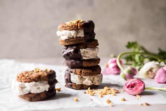 Chocolate Dipped Peanut Cookie Ice Cream Sandwiches | halfbakedharvest.com #icecream #chocolate #peanutbutter #summer horizontal front on photo of Chocolate Dipped Peanut Cookie Ice Cream Sandwiches