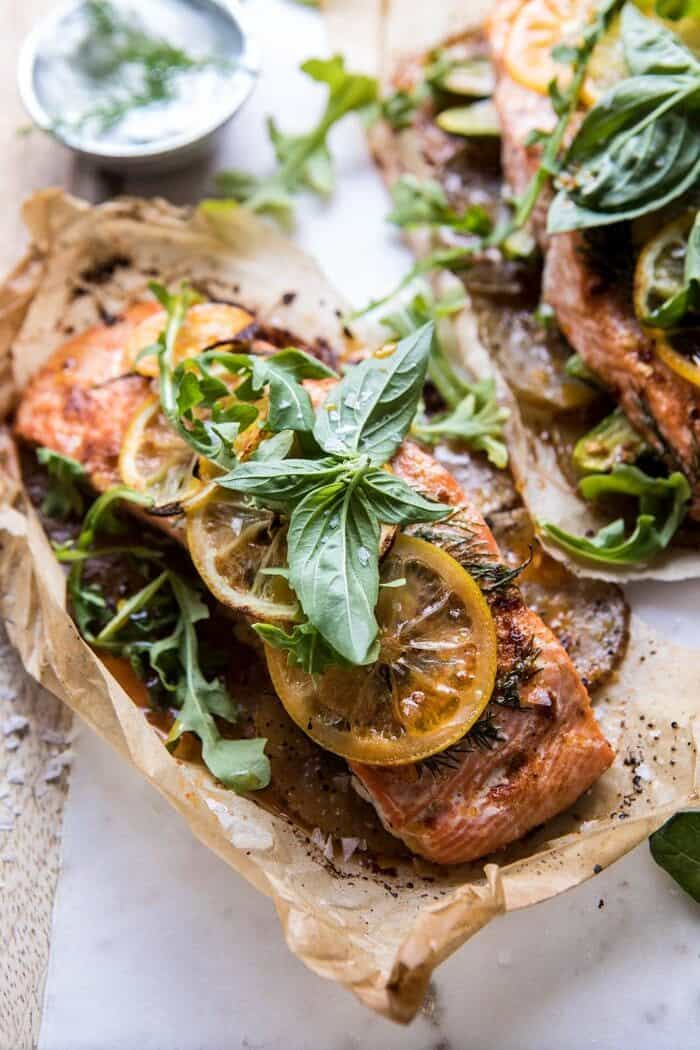side angle photo of Parchment Baked Lemon Salmon and Potatoes with Dill Yogurt 