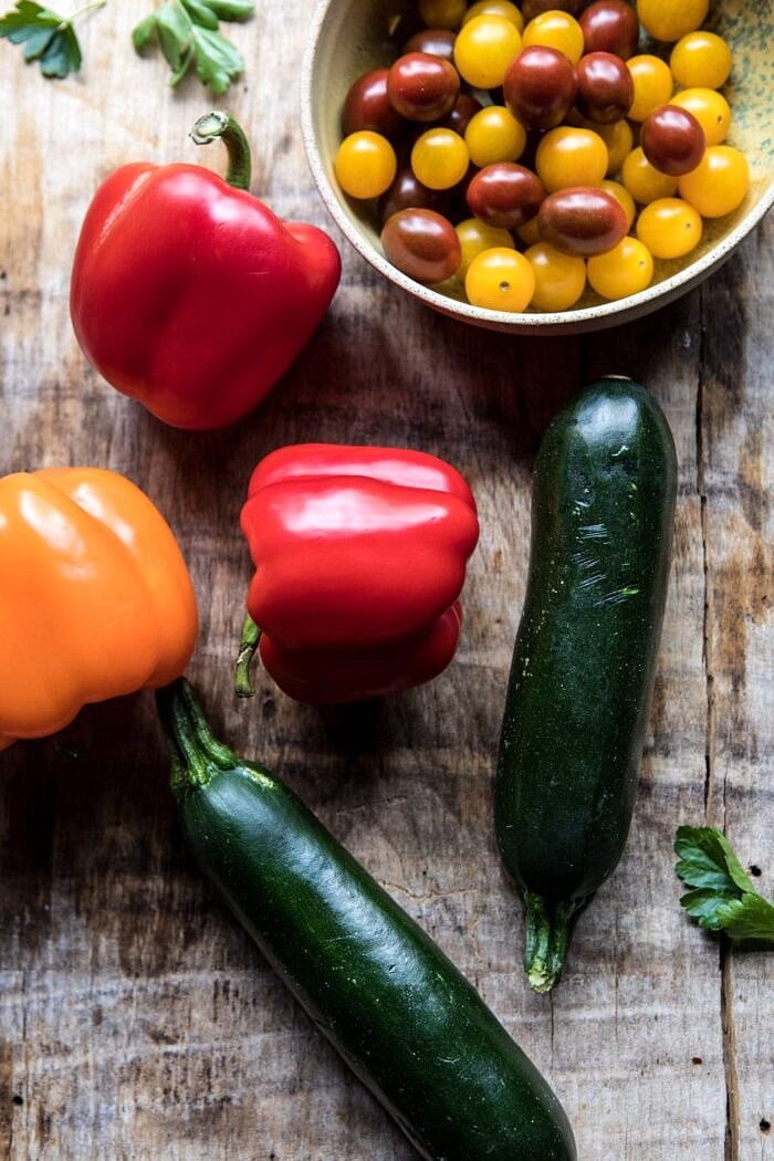 Skillet Lemon Pepper Chicken and Garden Veggies with Feta and Basil | halfbakedharvest.com #chicken #easyrecipes #summer overhead photo of raw vegetables