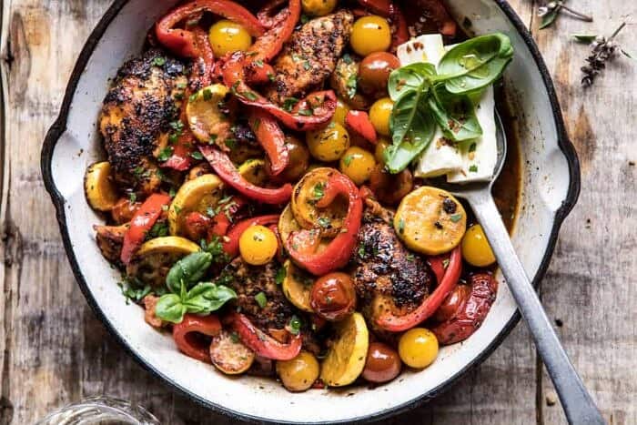 Skillet Lemon Pepper Chicken and Garden Veggies with Feta and Basil | halfbakedharvest.com #chicken #easyrecipes #summer overhead horizontal photo of Skillet Lemon Pepper Chicken and Garden Veggies with Feta and Basil