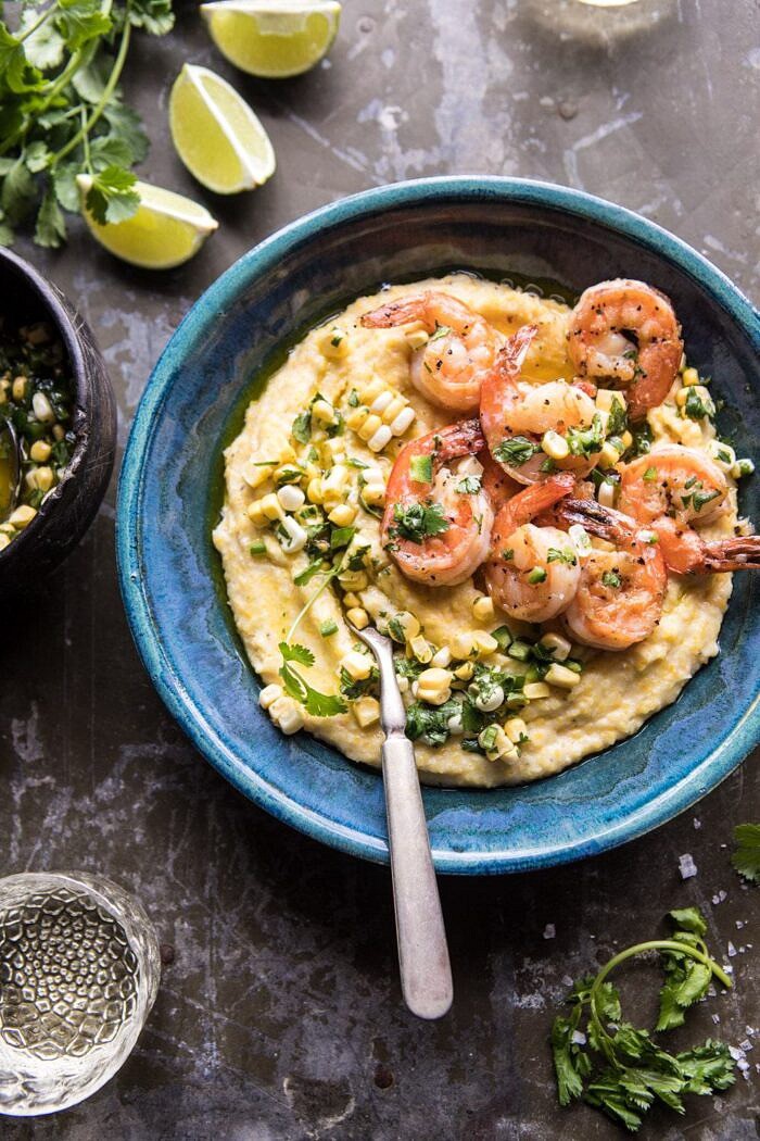 Sweet Corn Chimichurri Butter Shrimp with Polenta | halfbakedharvest.com #summer #shrimp #easyrecipes overhead photo of Sweet Corn Chimichurri Butter Shrimp with Polenta with fork in bowl