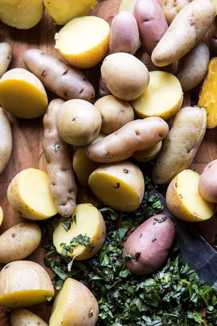 The Best Herby Potato Salad | halfbakedharvest.com #summer #easyrecipe #vegan #potatoes overhead prep photo of potatoes before salad dressing