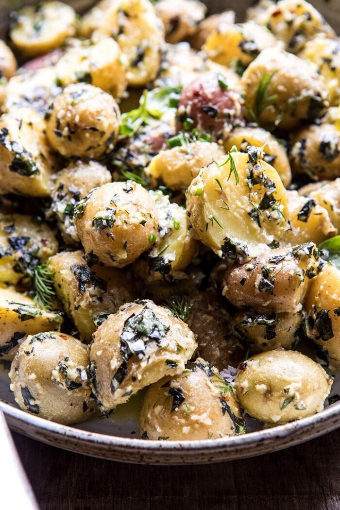 The Best Herby Potato Salad | halfbakedharvest.com #summer #easyrecipe #vegan #potatoes side angle close up photo of The Best Herby Potato Salad
