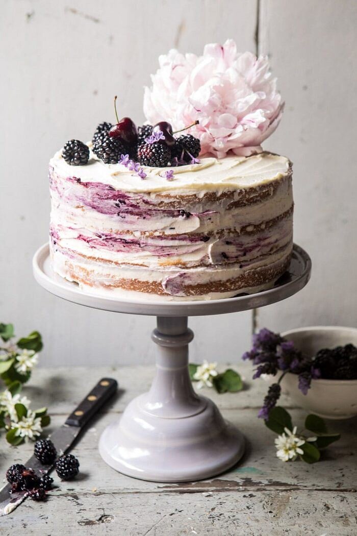 Blackberry Lavender Naked Cake with White Chocolate Buttercream | halfbakedharvest.com #summerrecipes #layercake #blueberries front on photo of Blackberry Lavender Naked Cake with White Chocolate Buttercream