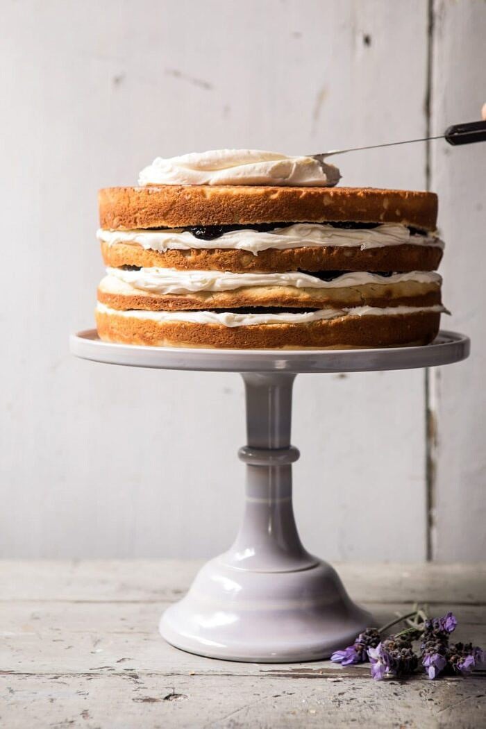Blackberry Lavender Naked Cake with White Chocolate Buttercream | halfbakedharvest.com #summerrecipes #layercake #blueberries photo of unfrosted Blackberry Lavender Naked Cake with White Chocolate Buttercream