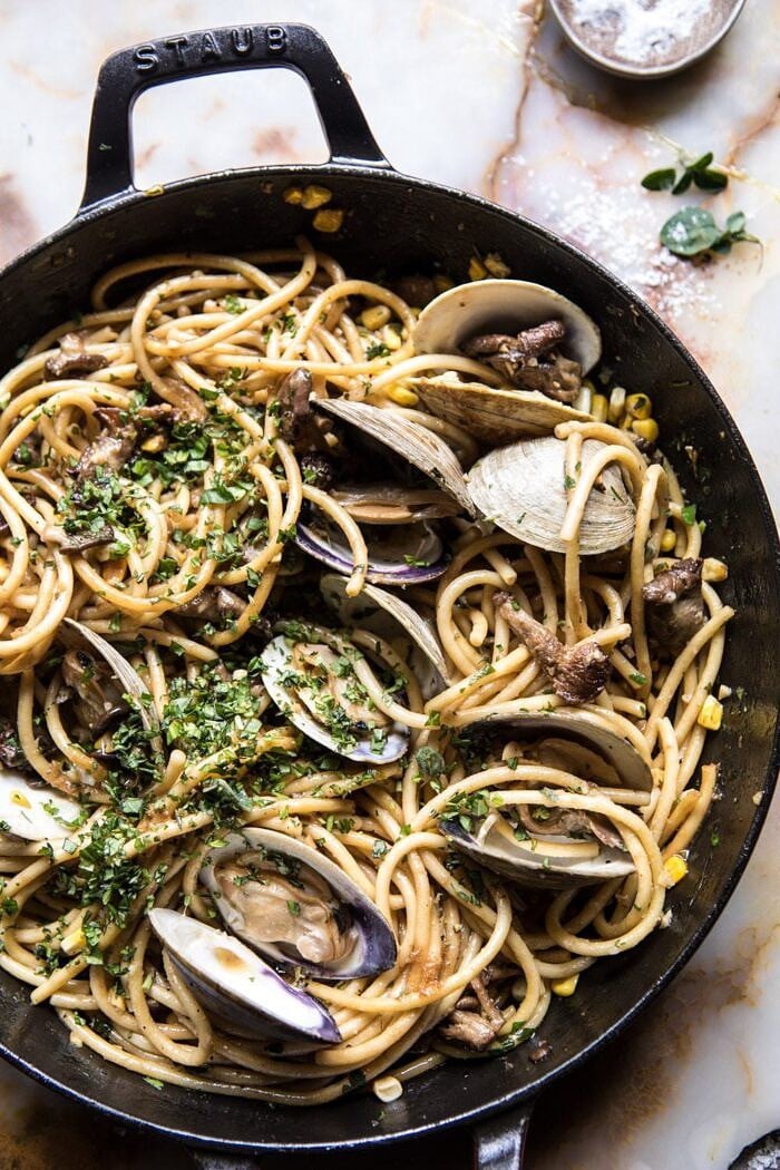 Buttery Mushroom and Clam Pasta | halfbakedharvest.com #pasta #easyrecipe #summerrecipes overhead photo of Buttery Mushroom and Clam Pasta in skillet