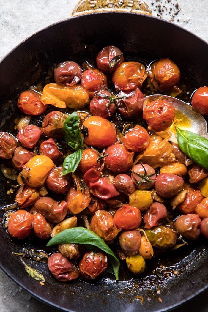 Fresh Fig, Prosciutto, and Arugula Salad with Cherry Tomato Vinaigrette | halfbakedharvest.com #summer #salad #tomatoes #burrata overhead photo of cherry tomato vinaigrette in skillet