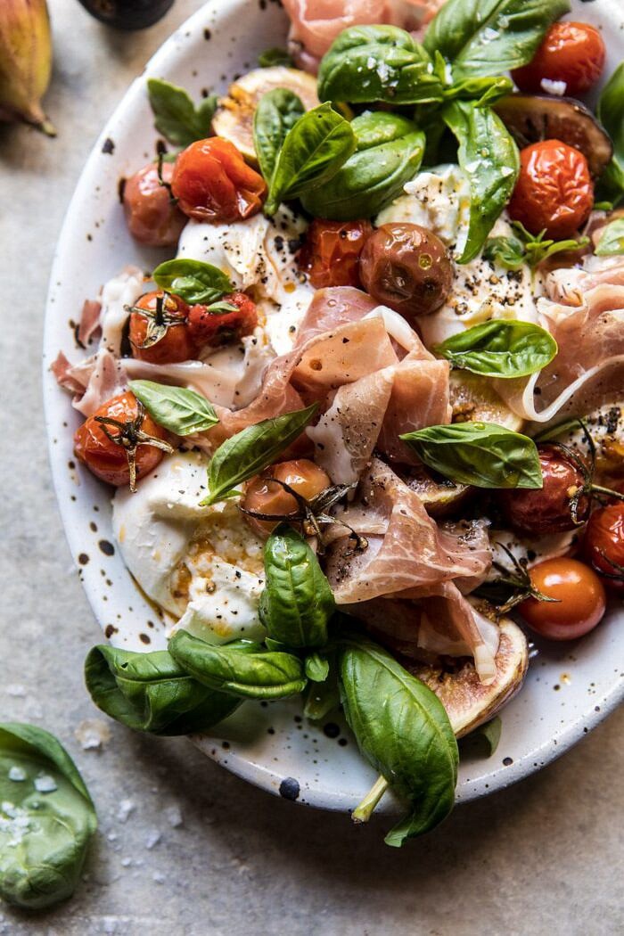 Fresh Fig, Prosciutto, and Arugula Salad with Cherry Tomato Vinaigrette | halfbakedharvest.com #summer #salad #tomatoes #burrata cropped photo of Fresh Fig, Prosciutto, and Arugula Salad with Cherry Tomato Vinaigrette