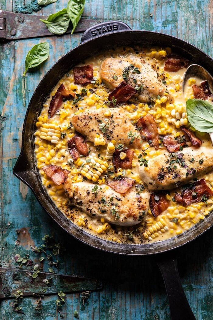 Garlic Butter Creamed Corn Chicken | halfbakedharvest.com #chicken #corn #summer #easy #dinner overhead photo of Garlic Butter Creamed Corn Chicken in skillet