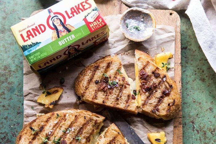Honey, Peach, and Brie Panini with Bacon Butter | halfbakedhavrest.com #grilledcheese #peaches #easyrecipes #summer overhead horizontal photo of Honey, Peach, and Brie Panini with Bacon Butter