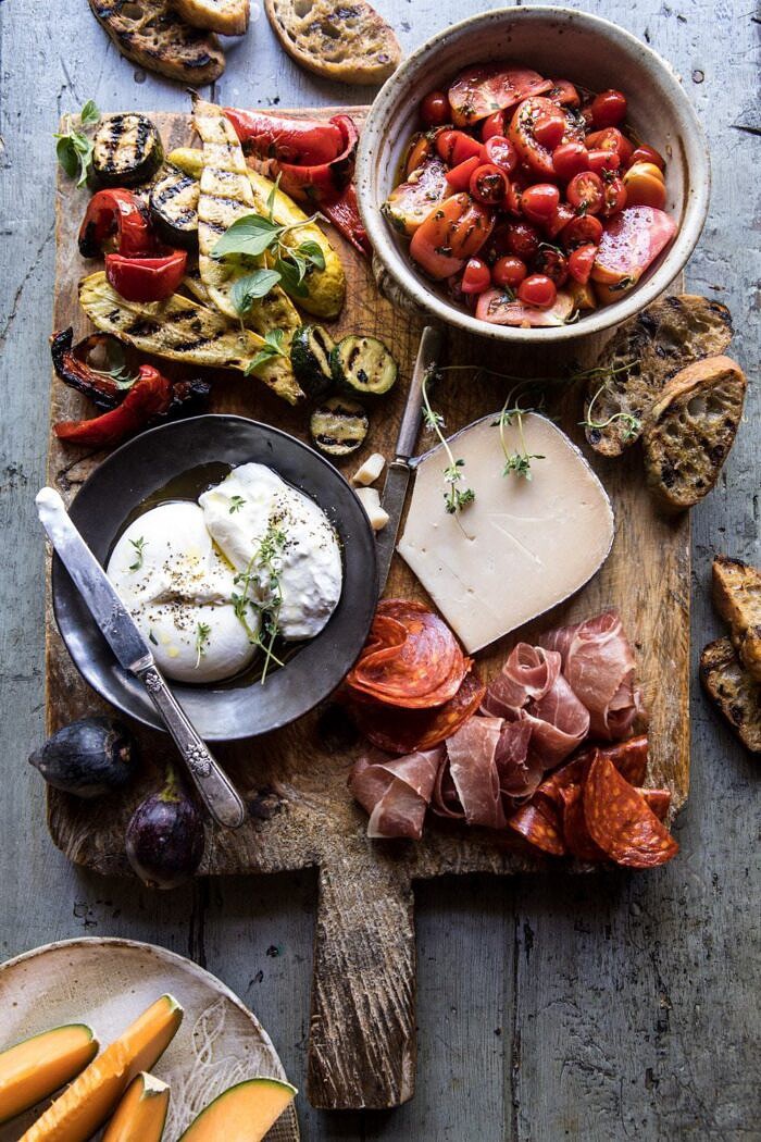 Marinated Tomato and Grilled Veggie Cheese Board | halfbakedharvest.com #cheeseboard #summerrecipes #easy #4thofjulyrecipe overhead photo of Marinated Tomato and Grilled Veggie Cheese Board