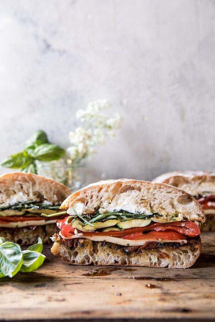 Marinated Veggie Cheese Sandwich with Sun-Dried Tomato Pesto | halfbakedharvest.com #easyrecipe #summer #sandwhich #healthyrecipes #dinner #easy #lunch front on far out photo of Marinated Veggie Cheese Sandwich with Sun-Dried Tomato Pesto