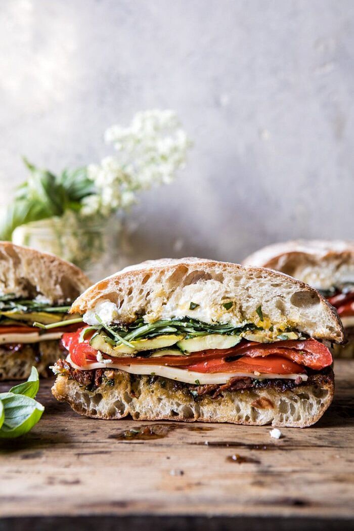 Marinated Veggie Cheese Sandwich with Sun-Dried Tomato Pesto | halfbakedharvest.com #easyrecipe #summer #sandwhich #healthyrecipes #dinner #easy #lunch front on close up photo of Marinated Veggie Cheese Sandwich with Sun-Dried Tomato Pesto