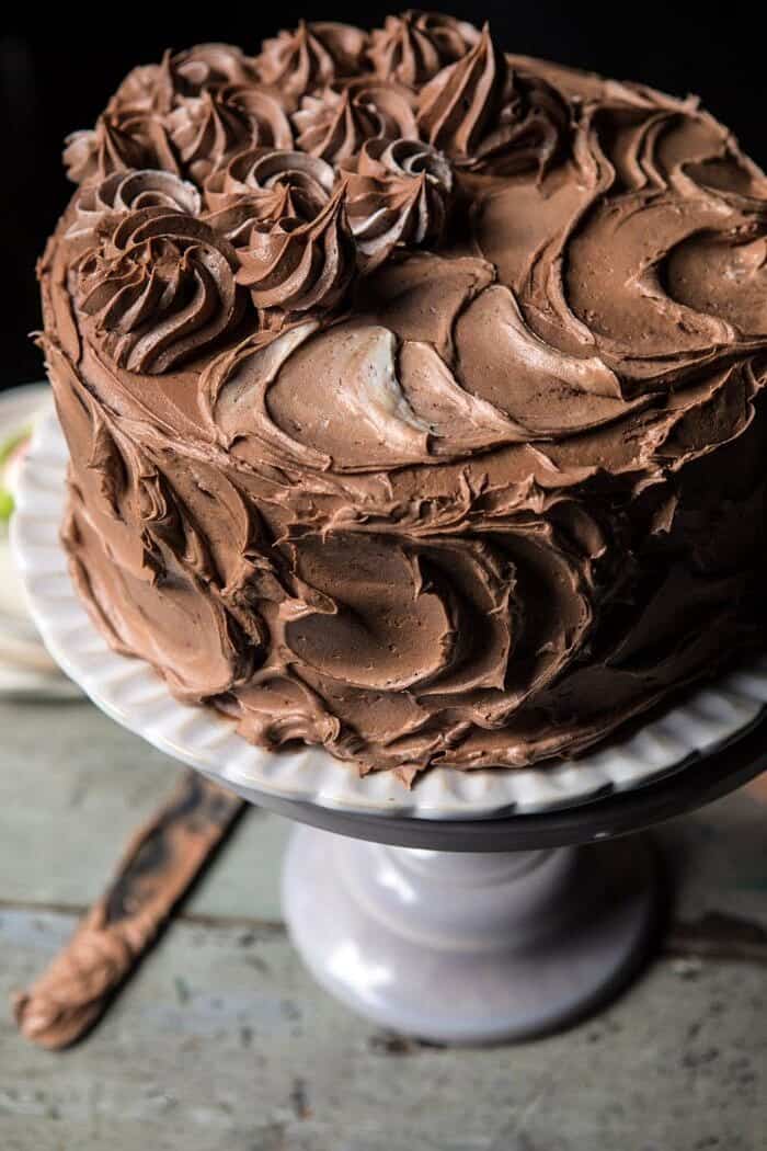 Better Together Chocolate Vanilla Birthday Cake | halfbakedharvest.com #chocolate #cake #birthdaycake #dessert close up side angle photo of Better Together Chocolate Vanilla Birthday Cake