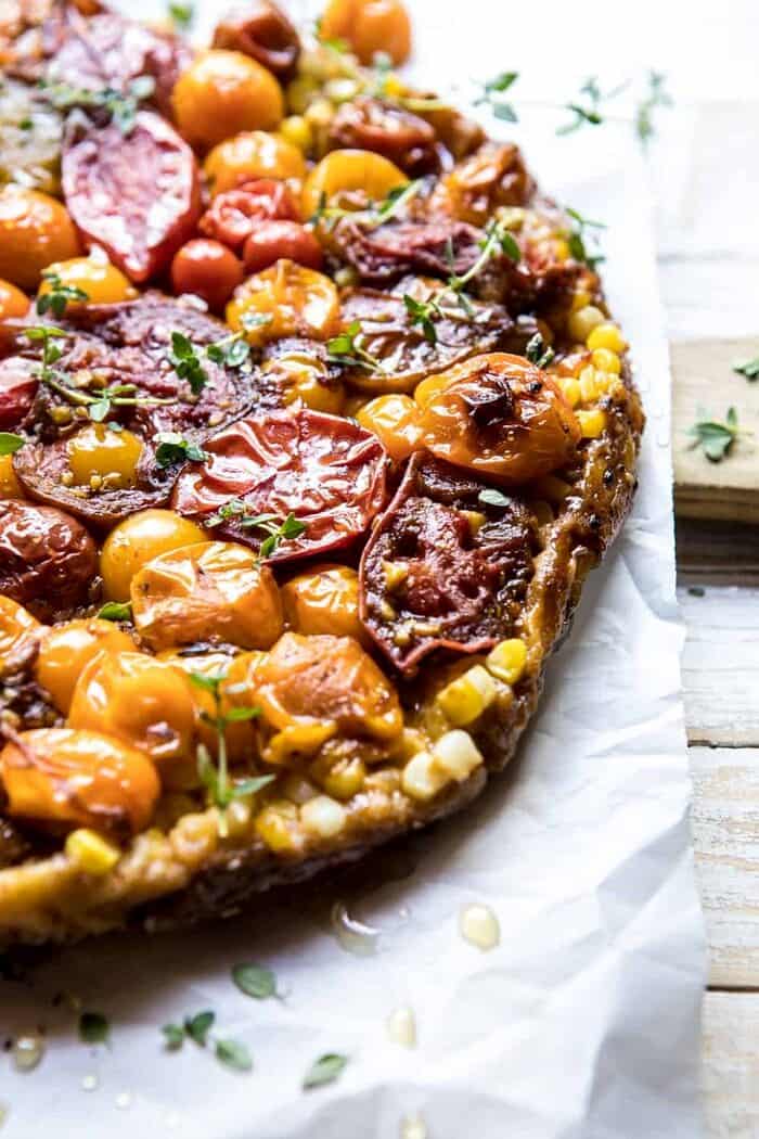 Caramelized Corn and Tomato Tarte Tatin | halfbakedharvest.com #simple #east #tomatoes #summer #tomatotart side angled photo of Caramelized Corn and Tomato Tarte Tatin