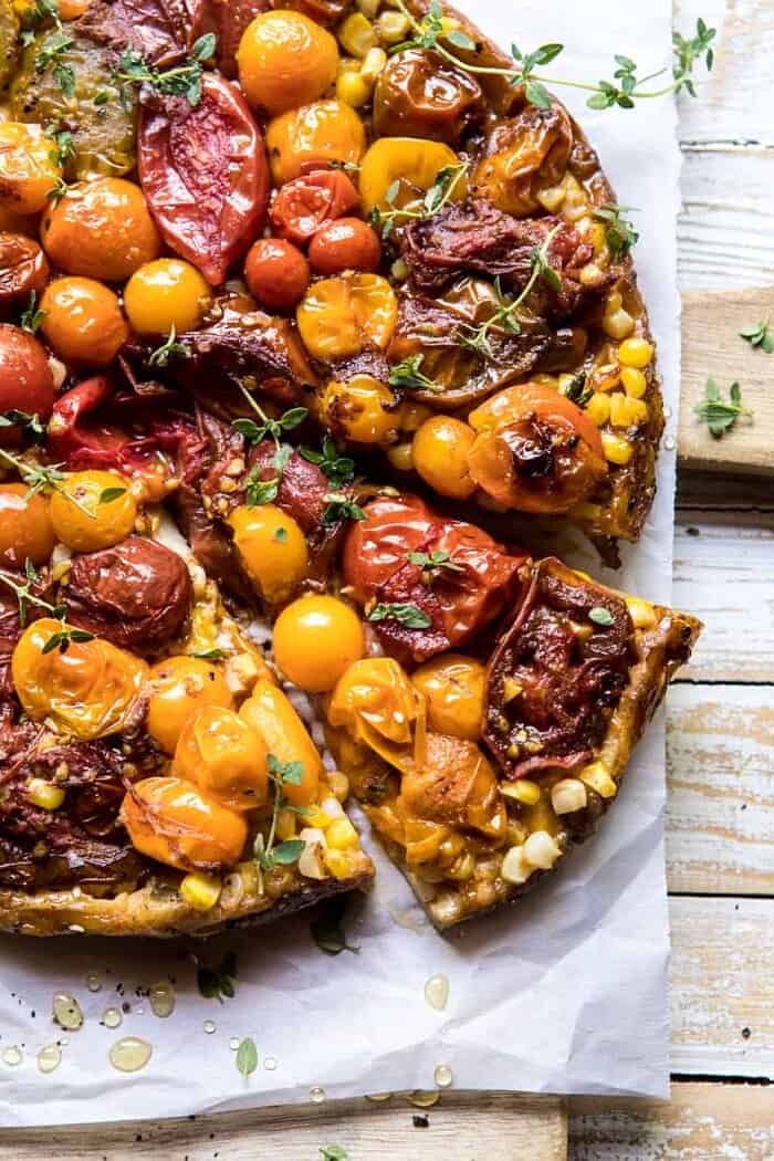 Caramelized Corn and Tomato Tarte Tatin | halfbakedharvest.com #simple #east #tomatoes #summer #tomatotart close up overhead photo of Caramelized Corn and Tomato Tarte Tatin