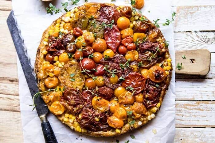 Caramelized Corn and Tomato Tarte Tatin | halfbakedharvest.com #simple #east #tomatoes #summer #tomatotart overhead horizontal photo of Caramelized Corn and Tomato Tarte Tatin