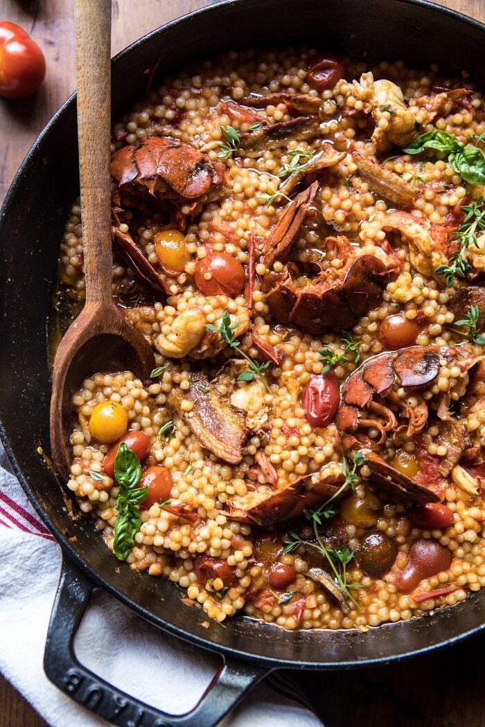 One Pot Tomato Basil Lobster and Herbed Pearl Couscous | halfbakedharvest.com #lobster #tomatoes #easyrecipes #summerrecipes #onepot close up overhead photo of One Pot Tomato Basil Lobster and Herbed Pearl Couscous