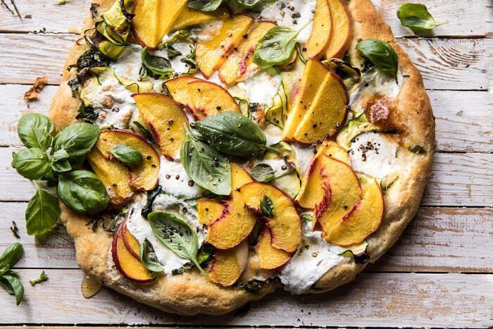 horizontal photo of Pesto Zucchini and Peach Pizza with Burrata