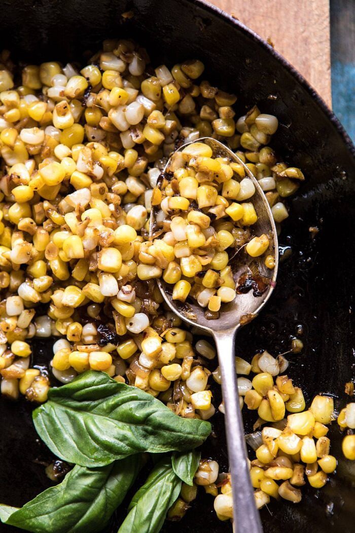 Rosemary Chicken, Caramelized Corn, and Peach Salad with Hot Bacon Vinaigrette | halfbakedharvest.com #salad #chicken #easyrecipes #summer #corn overhead photo of corn in skillet