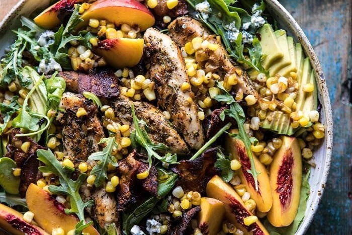 Rosemary Chicken, Caramelized Corn, and Peach Salad with Hot Bacon Vinaigrette | halfbakedharvest.com #salad #chicken #easyrecipes #summer #corn horizontal photo of Rosemary Chicken, Caramelized Corn, and Peach Salad with Hot Bacon Vinaigrette
