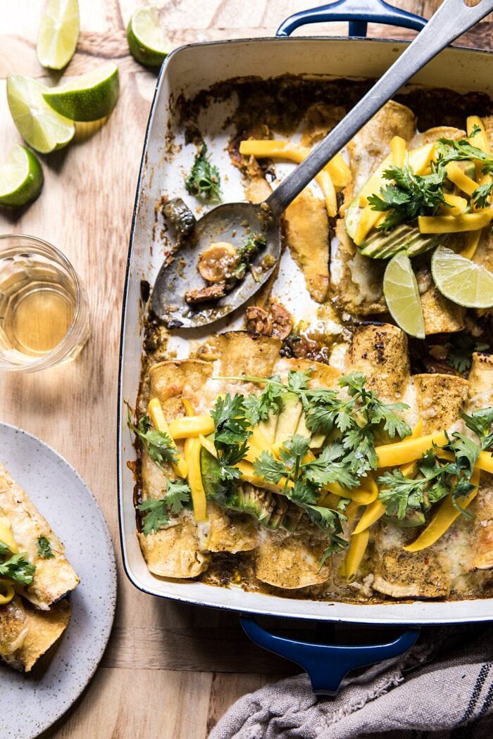 Salsa Verde Chicken and Zucchini Enchiladas with Mango | halfbakedharvest.com #mexican #enchiladas #zucchini #summerrecipes #easy Salsa Verde Chicken and Zucchini Enchiladas with Mango with enchiladas on a plate
