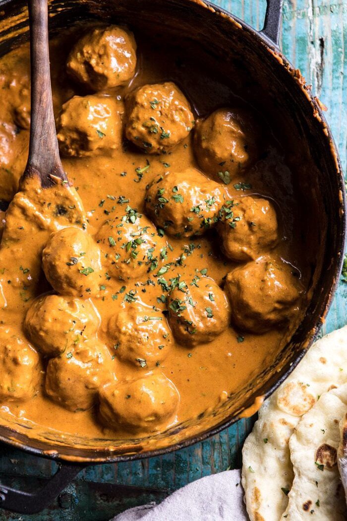 30 Minute Butter Chicken Meatballs | halfbakedharvest.com #meatballs #easyrecipes #Indianrecipes #curry #butterchicken 30 Minute Butter Chicken Meatballs in skillet with curry sauce