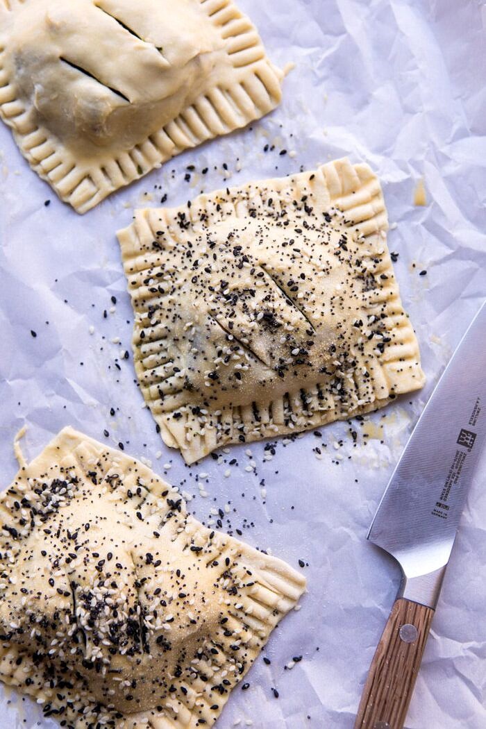 overhead photo Caramelized Onion, Spinach, and Cheddar Flaky Pastries before baking on baking sheet