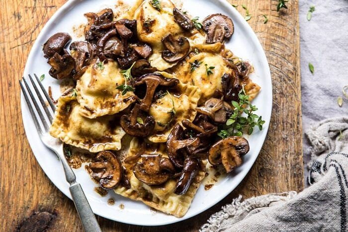 horizontal photo of Herby Buttered Balsamic Mushroom Ravioli