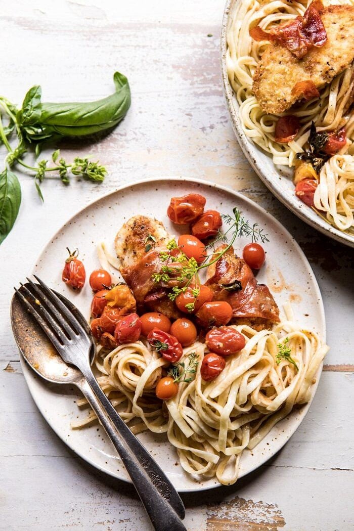 overhead photo of Prosciutto Chicken Parmesan with Garlic Butter Tomato Pasta on plate