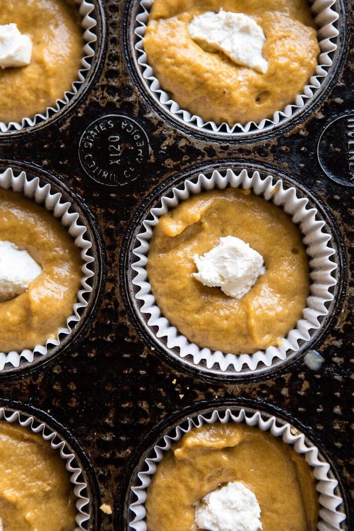 Pumpkin Coffee Cake Muffins with Cinnamon Honey Butter in muffin pan before baking