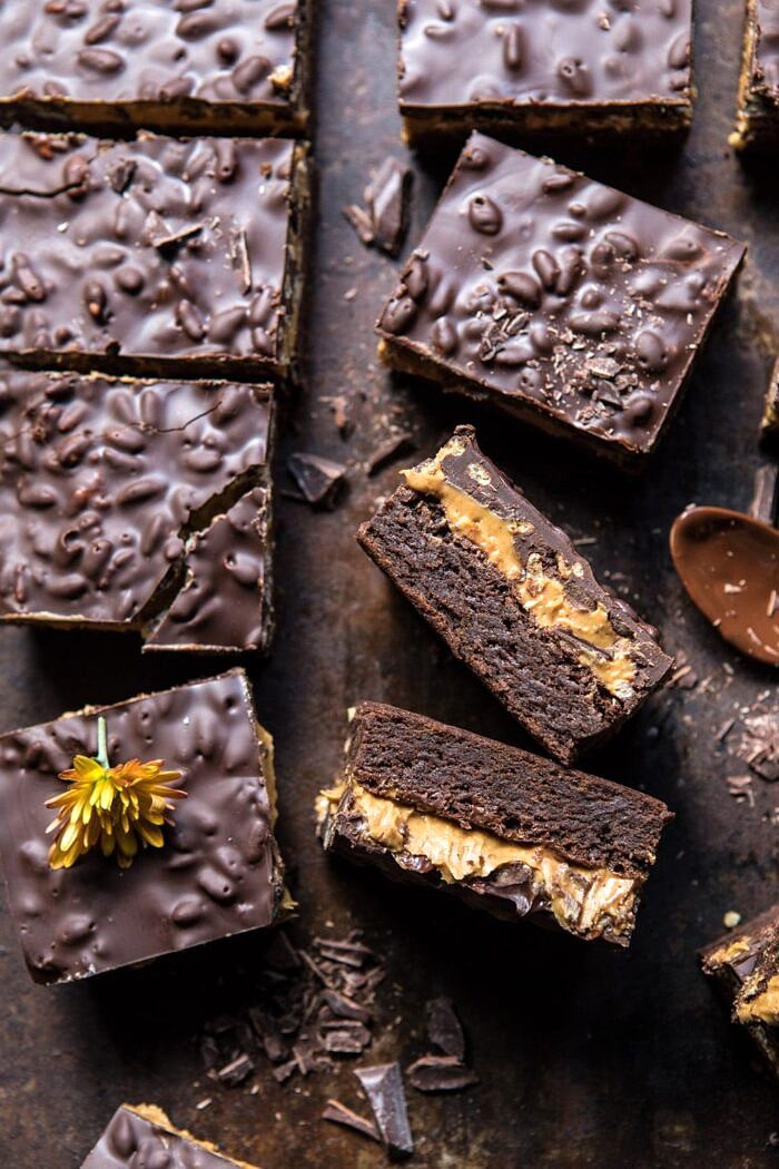 Triple Layer Peanut Butter Crunch Brownies | halfbakedharvest.com #brownies #peanutbutter #chocolate #fallrecipes close up photo of Triple Layer Peanut Butter Crunch Brownies