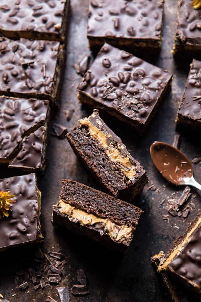 Triple Layer Peanut Butter Crunch Brownies | halfbakedharvest.com #brownies #peanutbutter #chocolate #fallrecipes side angle photo of Triple Layer Peanut Butter Crunch Brownies