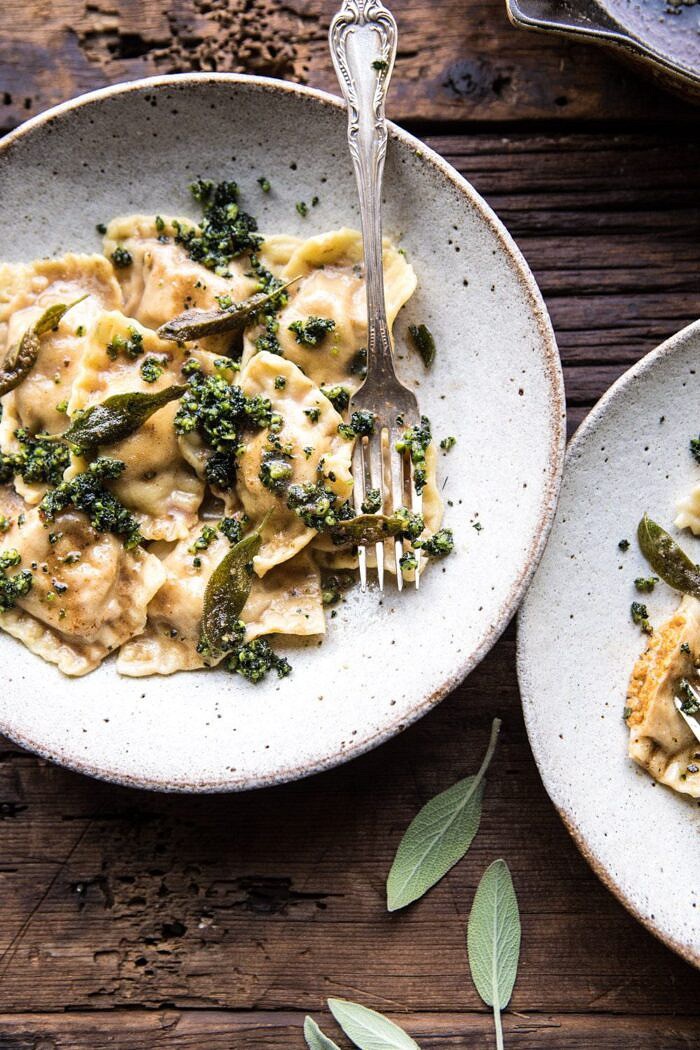 Butternut Squash Cheese Ravioli with Browned Butter Sage Pesto | halfbakedharvest.com #pasta #ravioli #fall #autumn #butternutsquash #fallrecipes overhead close up photo of Butternut Squash Cheese Ravioli with Browned Butter Sage Pesto