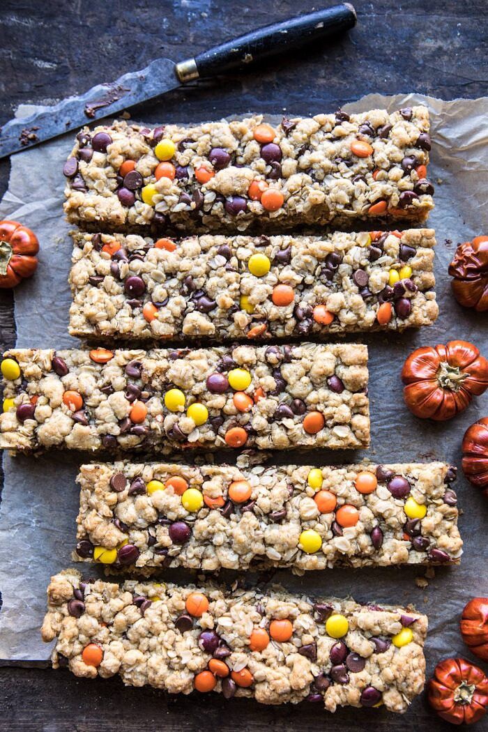 Monster Oatmeal Chocolate Chip Cookie Bars | halfbakedharvest.com #cookies #fall #autumn #halloween #thanksgiving #chocolate #easyrecipes over head photo of Monster Oatmeal Chocolate Chip Cookie Bars with knife and mini pumpkin in photo
