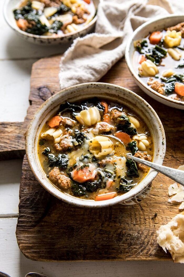 Spicy Italian Pesto Noodle Soup | halfbakedharvest.com #soup #easyrecipes #Italian #fall #autumn #winter #healthy side angle photo of Spicy Italian Pesto Noodle Soup