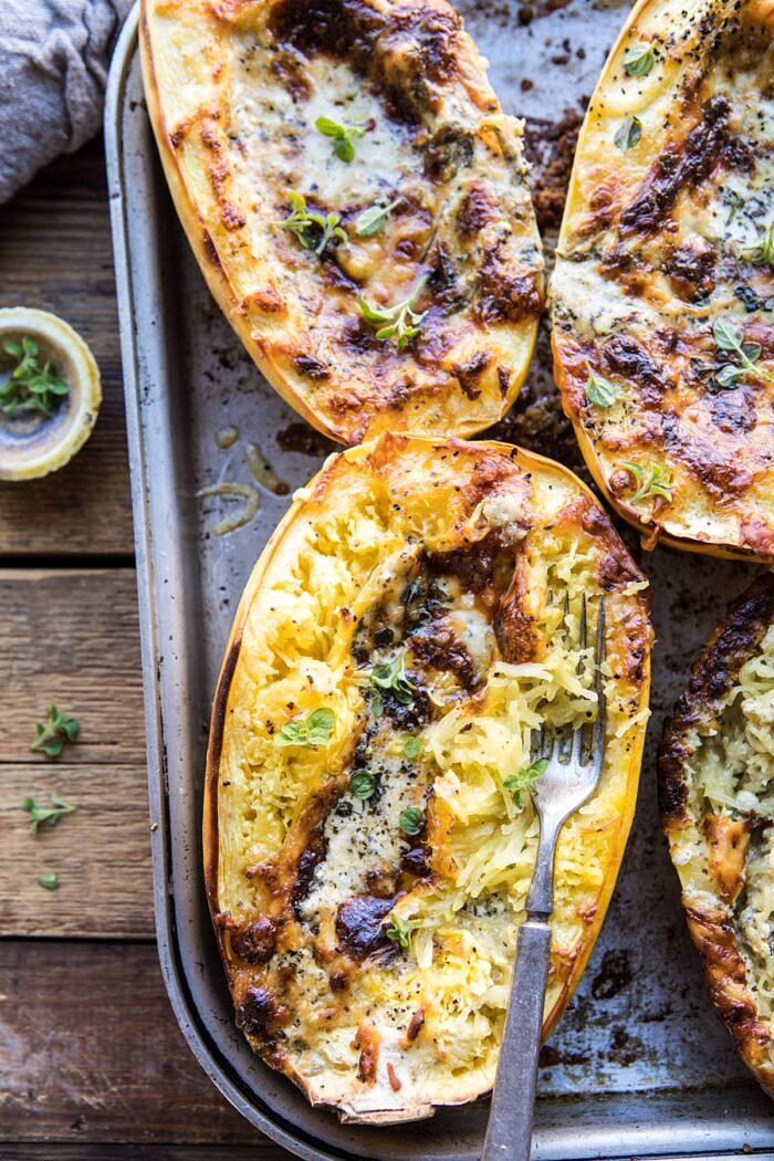 Stuffed Spaghetti Squash 4 Cheese Pesto Lasagna | halfbakedharvest.com #spaghettisquash #italian #easyrecipes #healthy #autumn #fallrecipes overhead close up photo of Stuffed Spaghetti Squash 4 Cheese Pesto Lasagna on baking sheet